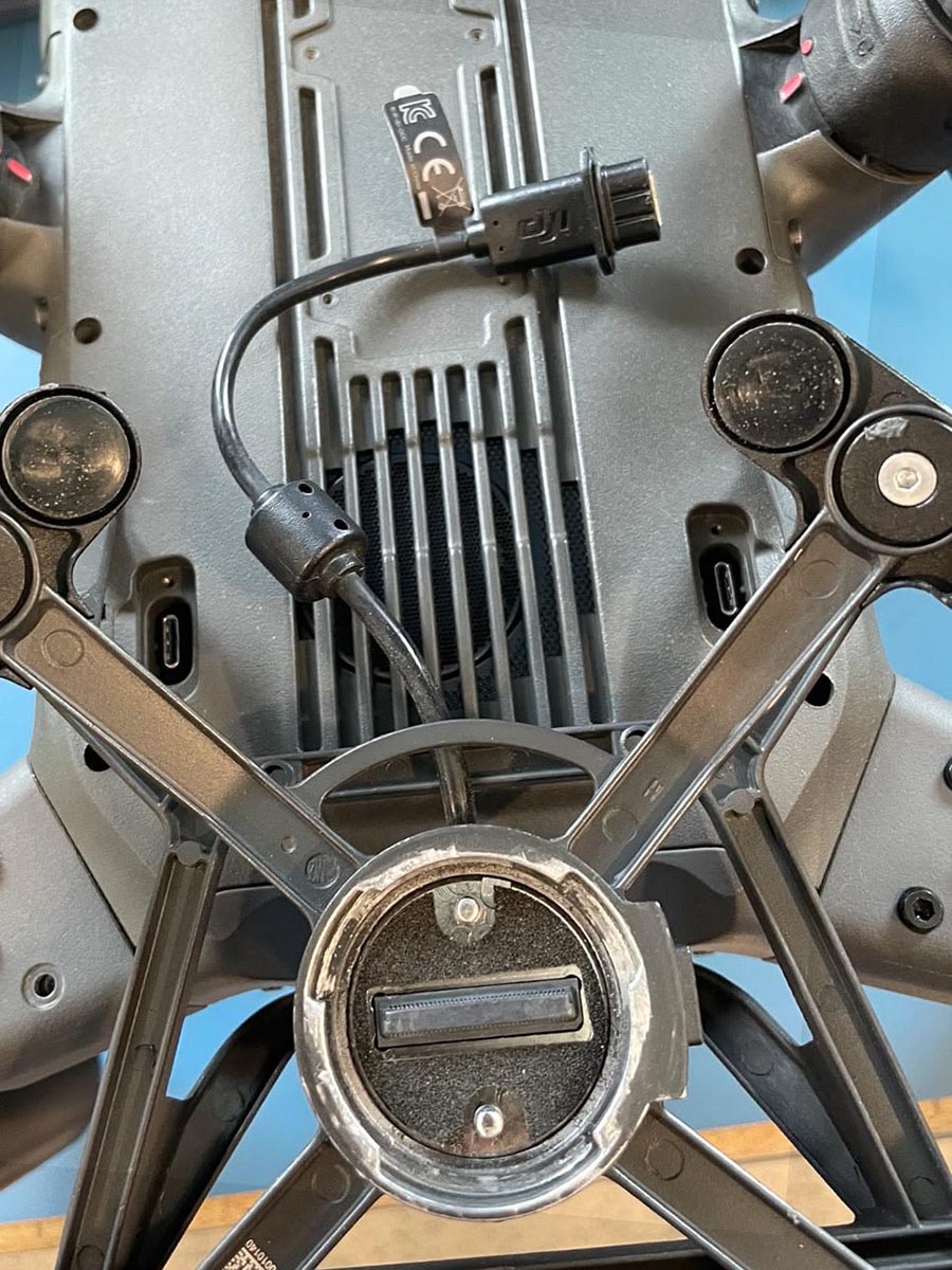 Disconnecting DJI gimbal power cable from underside port